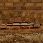 Brickwork arches in outer wall carefully restored