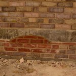 A finished brickwork arch restored in outer wall